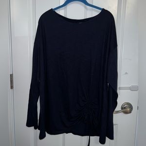 Navy blue long sleeve top but asymmetrical hem and pull ties.